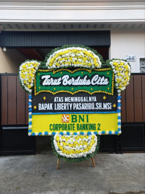 Papan Bunga Duka di Dorong