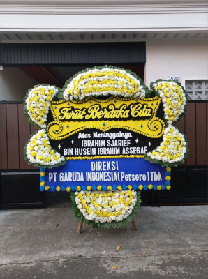 Papan Bunga Duka di Dorong