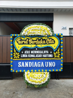 Papan Bunga Duka di Dorong